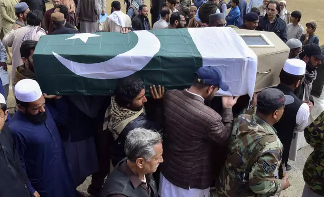 Mourners carry the coffin of a victim of the train attack, for a funeral prayer in Quetta, Pakistan's southwestern Balochistan province, Thursday March 13, 2025. (AP Photo/Arshad Butt)