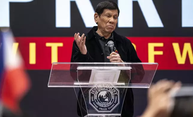 Former President of the Philippines Rodrigo Duterte speaks inside the Southorn Stadium during a thanksgiving gathering organized by Hong Kong-based Filipino workers for the former populist president in Hong Kong on Sunday, March 9, 2025. (AP Photo/Vernon Yuen)