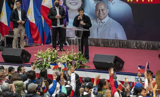 Former President of the Philippines Rodrigo Duterte speaks inside the Southorn Stadium during a thanksgiving gathering organized by Hong Kong-based Filipino workers for the former populist president in Hong Kong on Sunday, March 9, 2025. (AP Photo/Vernon Yuen)