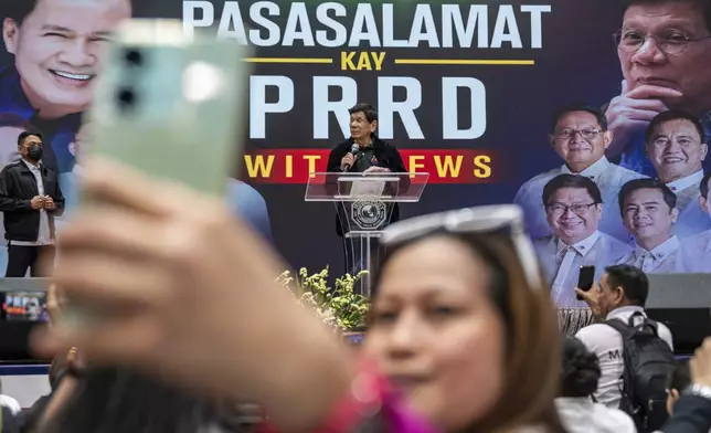 Former President of the Philippines Rodrigo Duterte speaks inside the Southorn Stadium during a thanksgiving gathering organized by Hong Kong-based Filipino workers for the former populist president in Hong Kong on Sunday, March 9, 2025. (AP Photo/Vernon Yuen)