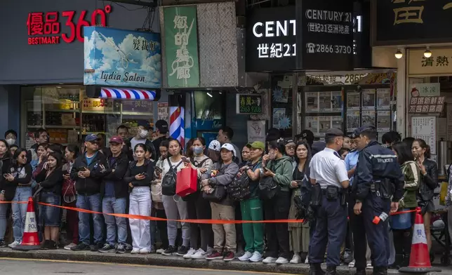 Supporters of former populist President of the Philippines Rodrigo Duterte waits for his arrival at a thanksgiving gathering organized by Hong Kong-based Filipino workers in Hong Kong on Sunday, March 9, 2025. (AP Photo/Vernon Yuen)