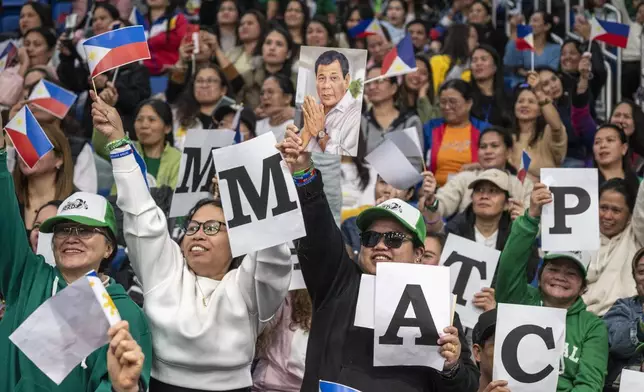 Supporters of former populist President of the Philippines Rodrigo Duterte cheer during a thanksgiving gathering organized by Hong Kong-based Filipino workers for him in Hong Kong on Sunday, March 9, 2025. (AP Photo/Vernon Yuen)