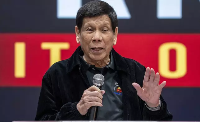 Former President of the Philippines Rodrigo Duterte speaks inside the Southorn Stadium during a thanksgiving gathering organized by Hong Kong-based Filipino workers for the former populist president in Hong Kong on Sunday, March 9, 2025. (AP Photo/Vernon Yuen)