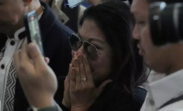 A supporter of former President Rodrigo Duterte reacts upon finding out he was arrested, at the airport in Manila, Philippines, Tuesday, March 11, 2025. (AP Photo/Aaron Favila)