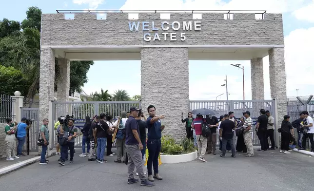 Media waits outside Villamor Air Base after former President Rodrigo Duterte was arrested, Tuesday, March 11, 2025, near Manila, Philippines. (AP Photo/Aaron Favila)