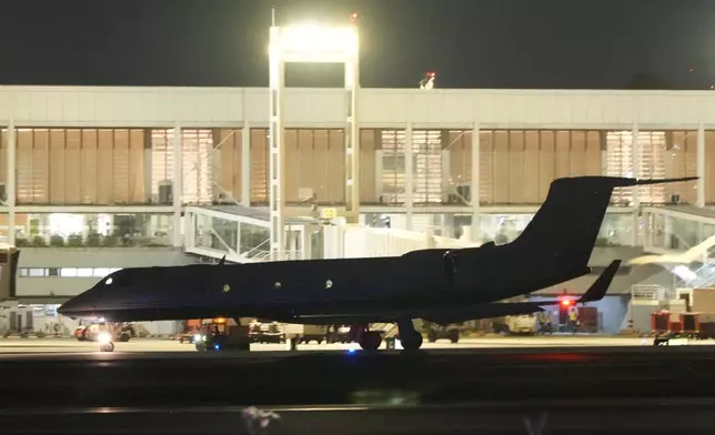 A plane carrying former President Rodrigo Duterte to The Hague prepares to take off in Manila, Philippines on Tuesday, March 11, 2025. (AP Photo/Aaron Favila)