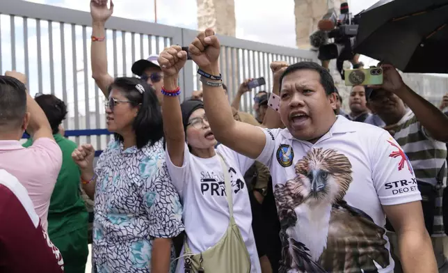Supporters rally outside Villamor Air Base after former President Rodrigo Duterte was arrested, Tuesday, March 11, 2025, near Manila, Philippines. (AP Photo/Aaron Favila)