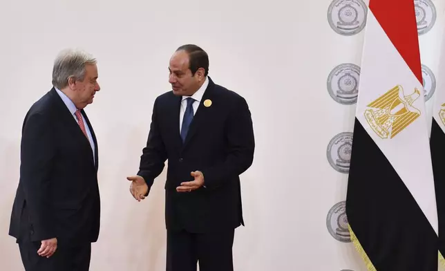 In this photo provided by Egypt's presidency media office, Egyptian President Abdel-Fattah el-Sissi, right, greets United Nations Secretary General Antonio Guterres during the emergency Arab summit at Egypt's New Administrative Capital, just outside Cairo, Tuesday, March 4, 2025. (Egyptian Presidency Media Office via AP)