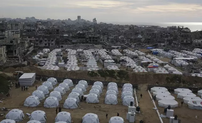 A tent camp for displaced Palestinians is set up amid destroyed buildings in the west of Al-Shati camp, west of Gaza City, on Monday, March 3, 2025. (AP Photo/Jehad Alshrafi)