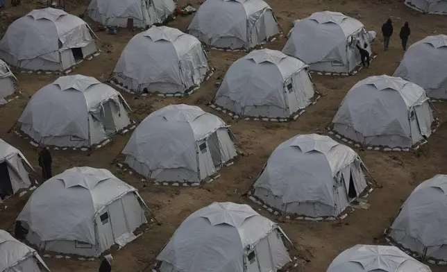 A tent camp for displaced Palestinians is set up amid destroyed buildings in the west of Al-Shati camp, west of Gaza City, on Monday, March 3, 2025. (AP Photo/Jehad Alshrafi)