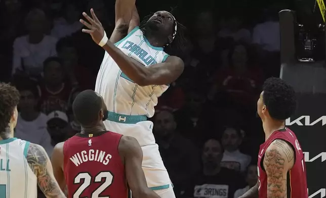 Charlotte Hornets center Mark Williams (5) drives to the basket during the first half of an NBA basketball game against the Miami Heat, Monday, March 10, 2025, in Miami. (AP Photo/Marta Lavandier)