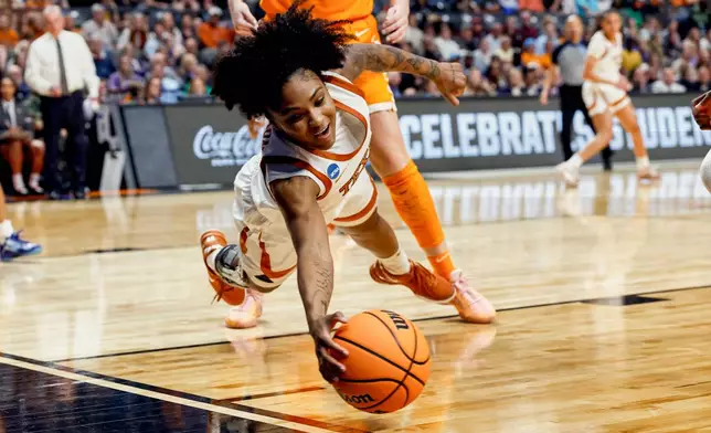Texas guard Rori Harmon (3) tries to save a ball from going out of bounds during the second half against Tennessee in the Sweet 16 of the NCAA college basketball tournament, Saturday, March 29, 2025, in Birmingham, Ala. (AP Photo/Butch Dill)