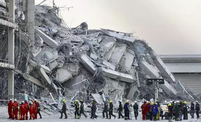 Rescuers work at the site a high-rise building under construction that collapsed after a 7.7 magnitude earthquake in Bangkok, Thailand, Friday, March 28, 2025. (AP Photo/Wason Wanichakorn)