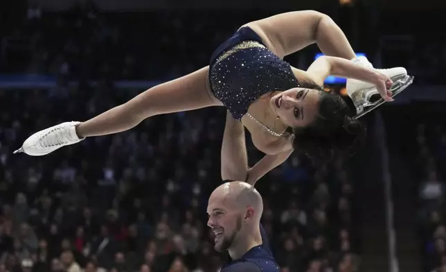 Ellie Kam and Danny O'Shea, of the United States, perform during their pairs short program at the figure skating world championships, Wednesday, March 26, 2025, in Boston. (AP Photo/Charles Krupa)