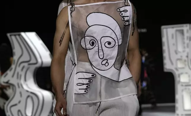 A model presents a creation by Shivan and Narresh during the Fashion Design Council of India (FDCI) Lakme Fashion Week (LFW) in Mumbai, India, Saturday, March 29, 2025. (AP Photo/Rajanish Kakade)