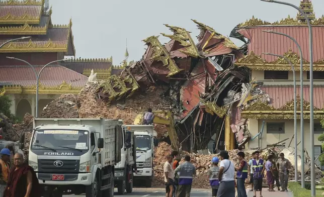 In this photo released by Xinhua News Agency, locals gather near a collapsed building in the aftermath of an earthquake in Mandalay, Myanmar on Saturday, March 29, 2025 (Myo Kyaw Soe/Xinhua via AP)