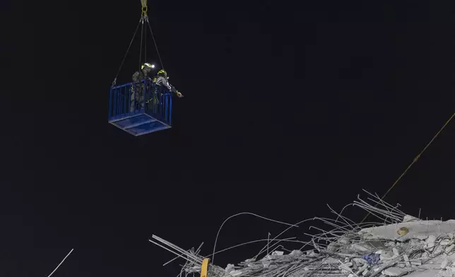 Rescuers work at the site of a collapsed under construction high-rise building in Bangkok, Thailand, early Sunday, March 30, 2025. (AP Photo/Wason Wanichakorn)