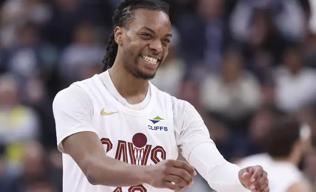 Cleveland Cavaliers guard Darius Garland reacts after a play against the Utah Jazz during the first half of an NBA basketball game, Sunday, March 23, 2025, in Salt Lake City. (AP Photo/Rob Gray)