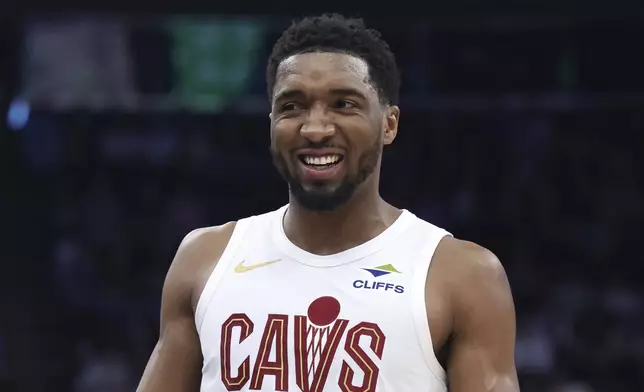 Cleveland Cavaliers guard Donovan Mitchell reacts after a play against the Utah Jazz during the first half of an NBA basketball game, Sunday, March 23, 2025, in Salt Lake City. (AP Photo/Rob Gray)