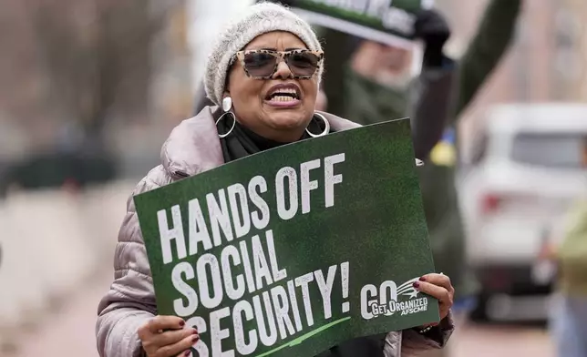 Demonstrators gather outside of the Edward A. Garmatz United States District Courthouse in Baltimore, on Friday, March 14, 2025, before a hearing regarding the Department of Government Efficiency's access to Social Security data. (AP Photo/Stephanie Scarbrough)