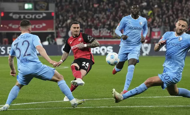 Leverkusen's Aleix Garcia scores during the German Bundesliga soccer match between Bayer Leverkusen and VfL Bochum at the BayArena in Leverkusen, Germany, Friday, March 28, 2025. (AP Photo/Martin Meissner)