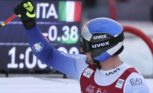 Italy's Dominik Paris reacts after completing an alpine ski, men's World Cup downhill, in Kvitfjell, Norway, Saturday, March 8, 2025. (AP Photo/Marco Trovati)