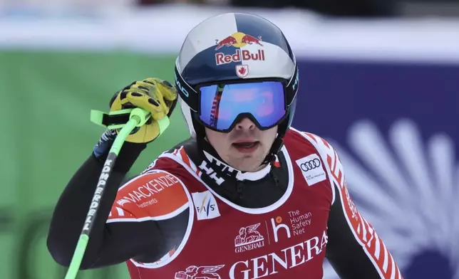 Canada's James Crawford reacts after completing an alpine ski, men's World Cup downhill, in Kvitfjell, Norway, Saturday, March 8, 2025. (AP Photo/Marco Trovati)