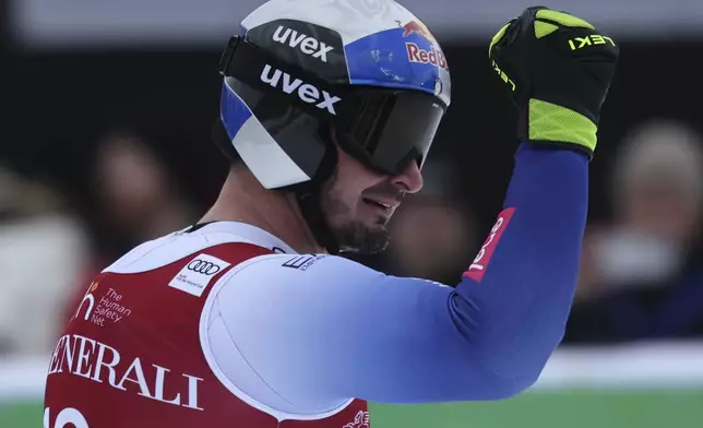 Italy's Dominik Paris reacts after completing an alpine ski, men's World Cup downhill, in Kvitfjell, Norway, Saturday, March 8, 2025. (AP Photo/Marco Trovati)