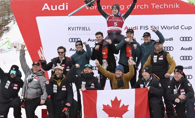 Second placed Canada's James Crawford, celebrates with the team after an alpine ski, men's World Cup downhill, in Kvitfjell, Norway, Saturday, March 8, 2025. (AP Photo/Marco Trovati)