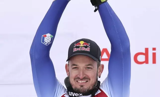The winner Italy's Dominik Paris celebrates after an alpine ski, men's World Cup downhill, in Kvitfjell, Norway, Saturday, March 8, 2025. (AP Photo/Marco Trovati)