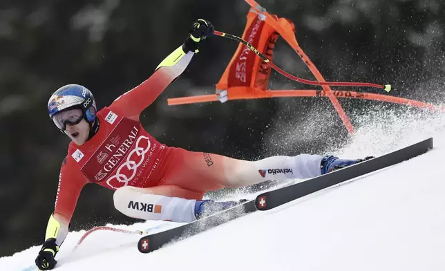 Switzerland's Marco Odermatt speeds down the course during an alpine ski, men's World Cup super G race, in Kvitfjell, Norway, Sunday, March 9, 2025. (AP Photo/Gabriele Facciotti)