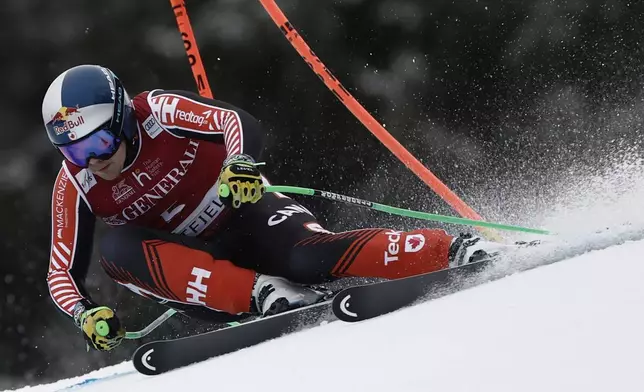 Canada's James Crawford speeds down the course during an alpine ski, men's World Cup super G race, in Kvitfjell, Norway, Sunday, March 9, 2025. (AP Photo/Gabriele Facciotti)