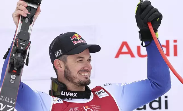 The winner Italy's Dominik Paris celebrates after an alpine ski, men's World Cup downhill, in Kvitfjell, Norway, Saturday, March 8, 2025. (AP Photo/Marco Trovati)