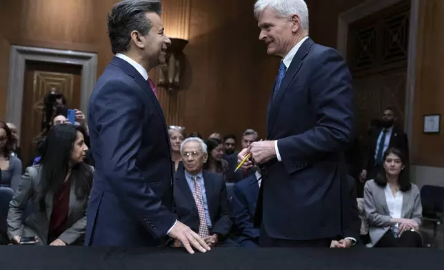 Martin Makary, left, nominated to serve as Commissioner of Food and Drugs, Department of Health and Human Services, speaks with Sen. Bill Cassidy, R-La., Chairman of the Senate Committee on Health, Education, Labor and Pensions during his nomination hearing on Capitol Hill Thursday, March 6, 2025, in Washington. (AP Photo/Jose Luis Magana)