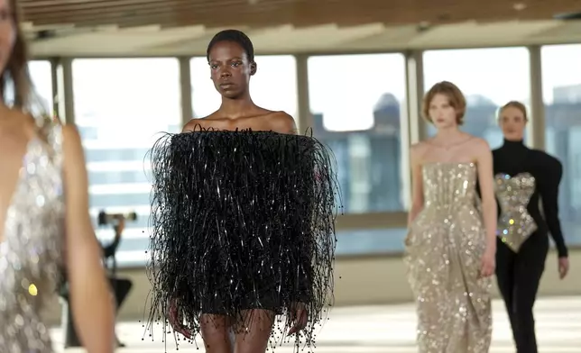 Models wear creations as part of the Stella Mccartney Fall/Winter 2025-2026 Womenswear collection presented in Paris, Wednesday, March 5, 2025. (Photo by Scott A Garfitt/Invision/AP)