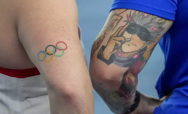 Sarah Mitton of Canada, left, and Chase Jackson, of the United States, participate in the women's Shot Put final during the World Athletics Indoor Championships in Nanjing, China, Friday, March 21, 2025. (AP Photo/Dar Yasin)