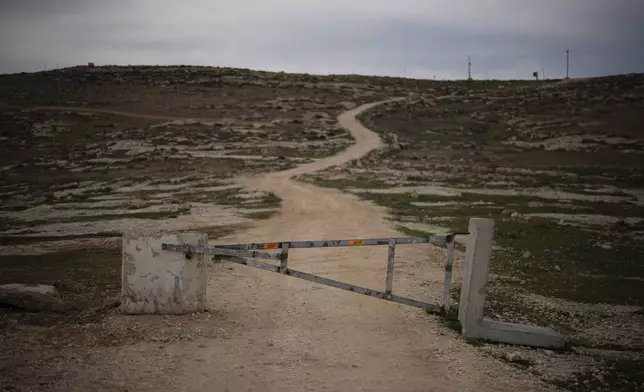 A gate blocks the access for Palestinians, according to local residents, on an area of an Israeli settlers’ outpost near the West Bank village of Tuwani, Monday, March 3, 2025. (AP Photo/Leo Correa)