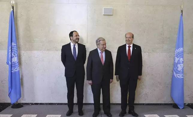 From left, Cyprus President Nikos Christodoulides, UN Secretary-General Antonio Guterres and Turkish Cypriot leader Ersin Tatar pose for a photo, ahead of a meeting to discuss the future of stalled peace talks over the divided island of Cyprus at the United Nations in Geneva, Switzerland, Tuesday, March 18, 2025. (Pierre Albouy/Keystone via AP)