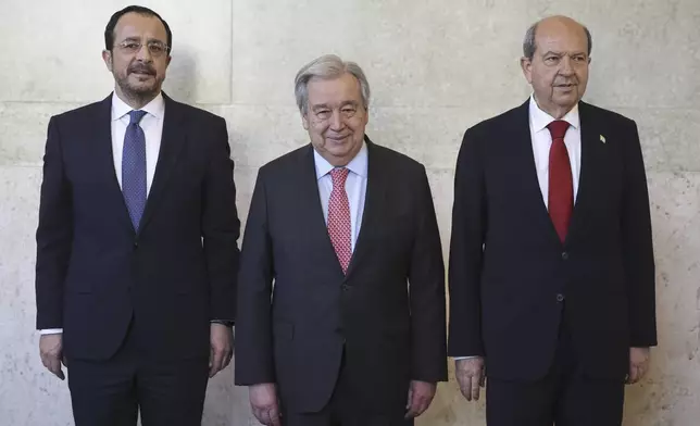 From left, Cyprus President Nikos Christodoulides, UN Secretary-General Antonio Guterres and Turkish Cypriot leader Ersin Tatar pose for a photo, ahead of a meeting to discuss the future of stalled peace talks over the divided island of Cyprus at the United Nations in Geneva, Switzerland, Tuesday, March 18, 2025. (Pierre Albouy/Keystone via AP)