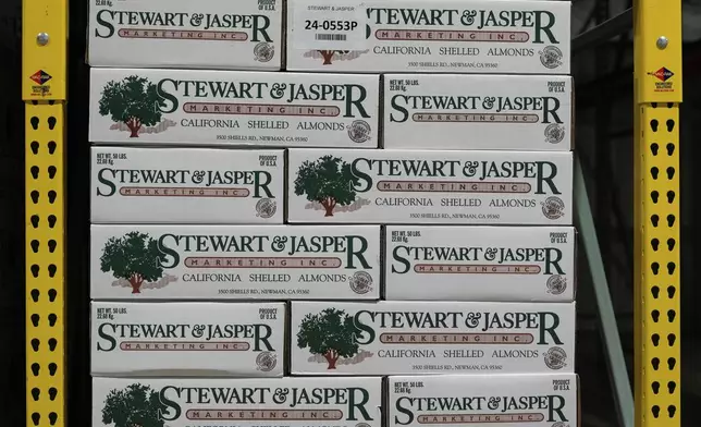 Fifty-pound boxes of almonds are stacked in a refrigerated storage room at Stewart and Jasper Orchards, Friday, March 7, 2025, in Newman, Calif. (AP Photo/Godofredo A. Vásquez)