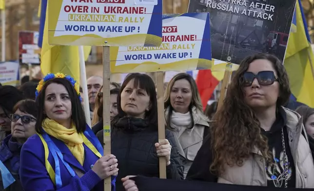 Ukrainian supporters demonstrate outside Downing Street with flags and placards as Britain's Prime Minister Keir Starmer holds a Ukraine Summit at Lancaster House in London, Sunday, March 2, 2025.(AP Photo/Alberto Pezzali)