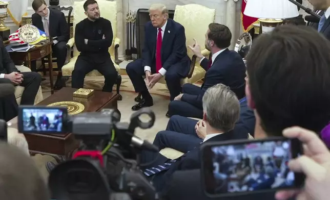 Vice President JD Vance, right, speaks with Ukrainian President Volodymyr Zelenskyy, left, as President Donald Trump, center, listens in the Oval Office at the White House, Friday, Feb. 28, 2025, in Washington. (AP Photo/ Mystyslav Chernov)