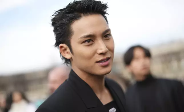 Mingyu poses for photographers at the Dior Fall/Winter 2025-2026 Womenswear collection presented Tuesday, March 4, 2025. in Paris. (Photo by Scott A Garfitt/Invision/AP)