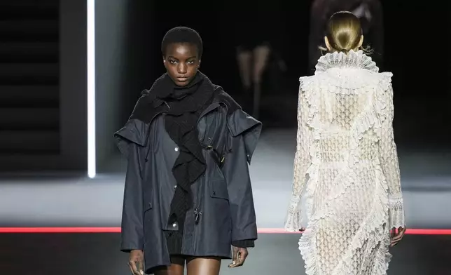 Models wears creations as part of the Dior Fall/Winter 2025-2026 Womenswear collection presented Tuesday, March 4, 2025. in Paris. (Photo by Scott A Garfitt/Invision/AP)