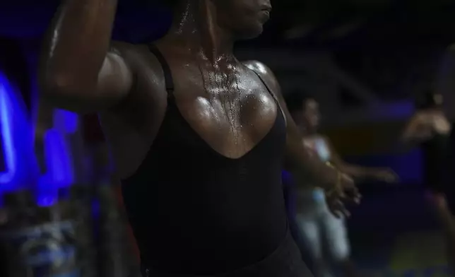 Transgender woman Negriny Venture rehearses at the Paraiso de Tuiuti samba school for the Carnival parade in Rio de Janeiro, Wednesday, Feb. 5, 2025. (AP Photo/Silvia Izquierdo)