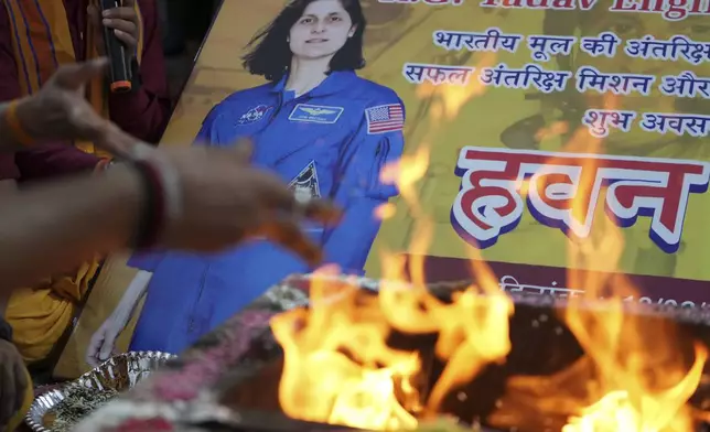 Indians performs rituals for the safe return of American astronaut of Indian origin Sunita Williams from the International Space Station (ISS), in Ahmedabad, India, Tuesday, March 18, 2025. (AP Photo/Ajit Solanki)