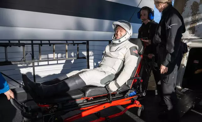 NASA astronaut Butch Wilmore is helped out of a SpaceX capsule onboard the SpaceX recovery ship Megan after landing in the water off the coast of Tallahassee, Fla., Tuesday, March 18, 2025. (Keegan Barber/NASA via AP)