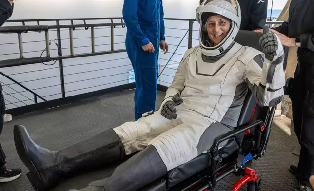 NASA astronaut Suni Williams gives a thumbs-up after being helped out of a SpaceX capsule onboard the SpaceX recovery ship Megan after landing in the water off the coast of Tallahassee, Fla., Tuesday, March 18, 2025. (Keegan Barber/NASA via AP)