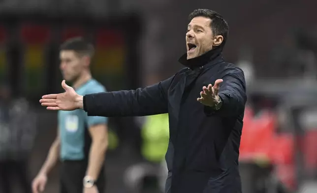 Leverkusen's head head coach Xabi Alonso reacts during the German Bundesliga soccer match between Eintracht Frankfurt and Bayer Leverkusen in Frankfurt, Germany, Saturday, March 1, 2025. (Arne Dedert/dpa via AP)
