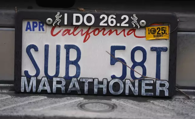 The license plate of Los Angeles Marathon participant Rick Bingham is shown in Lake Elsinore, Calif., Tuesday, March 11, 2025. (AP Photo/Damian Dovarganes)
